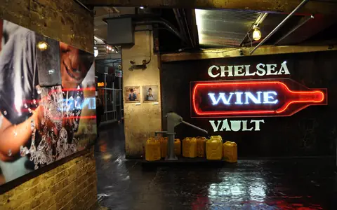 The neon sign of Chelsea Wine Vault inside Chelsea Market