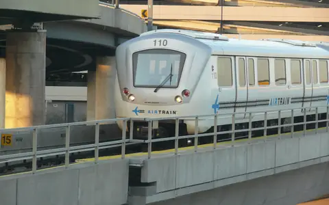 An AirTrain JFK train on its elevated guideway