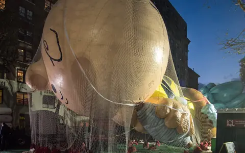 A Macy's Thanksgiving Day Parade balloon being inflated the night before the parade
